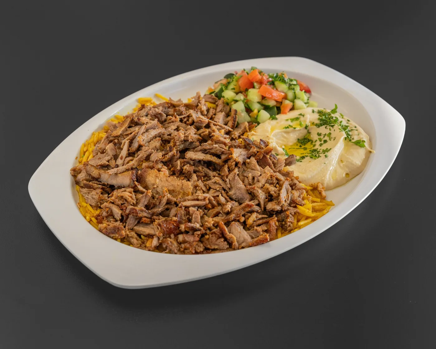 Beef shawarma plate with rice, hummus, and salad